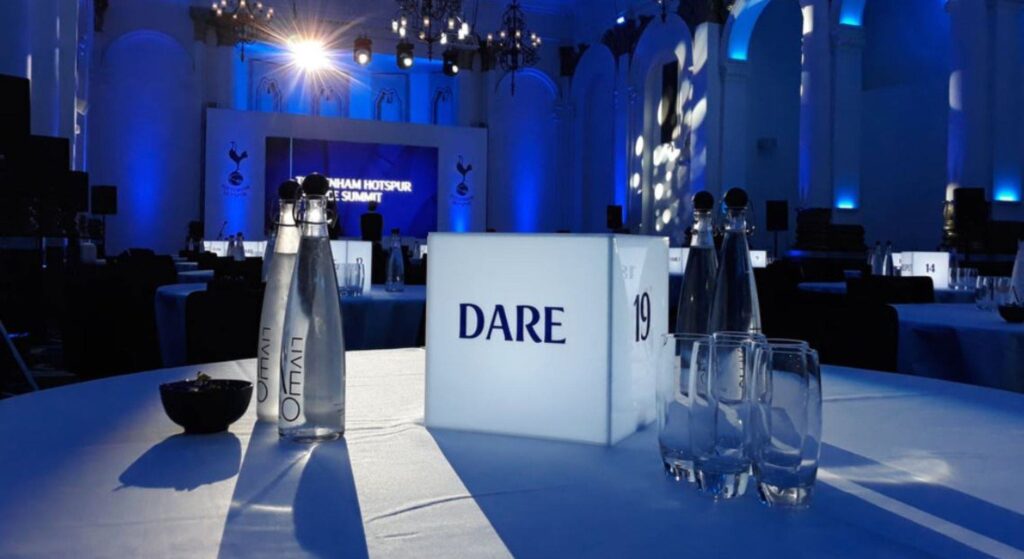Bespoke branded table centrepiece at a gala event for Hotspur with DARE written on it.