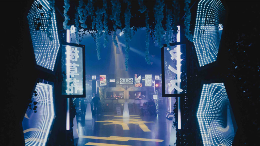 A sidemen event with futuristic design and neon lighting