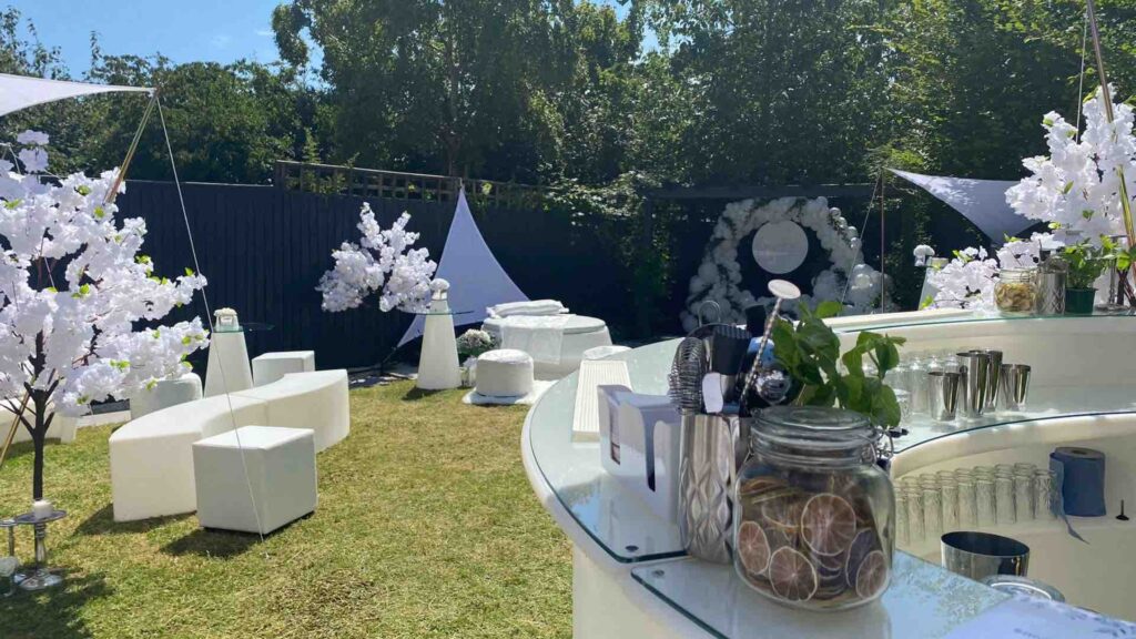 A white party theme outdoors at an event.