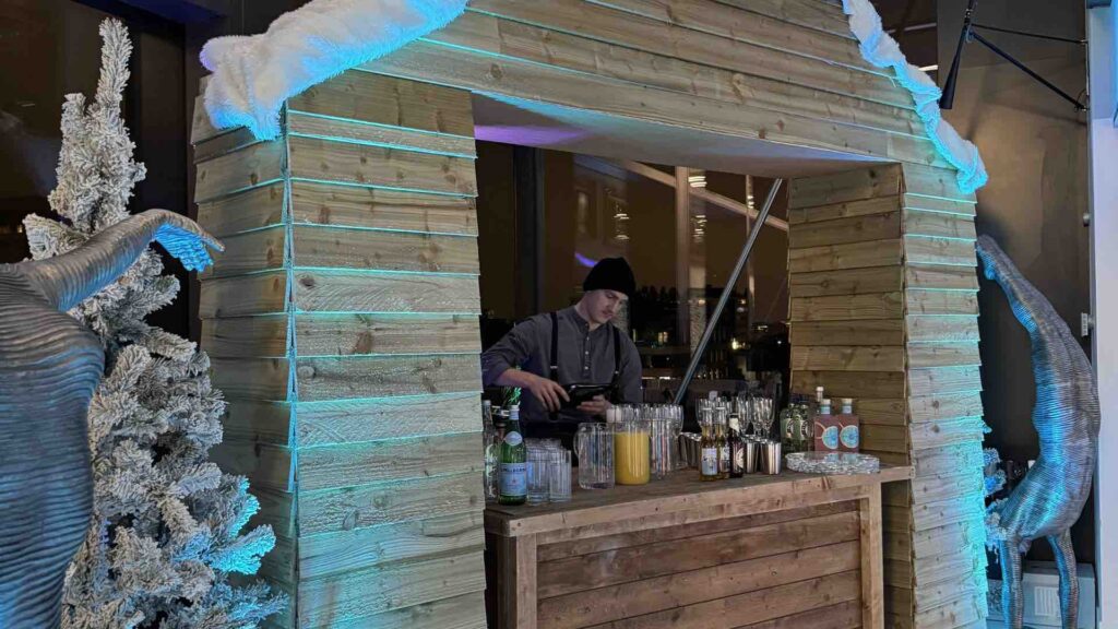 A chalet bar at an indoor Christmas event.