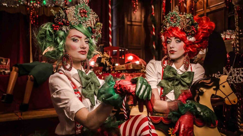 Two walkabout festive elves for Christmas events.