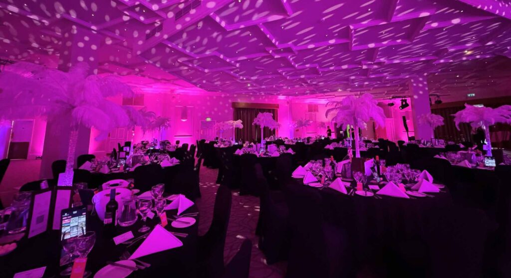 Gala event planned and produced by Julia Charles Event Management. Featuring table linen, centrepieces, bespoke staging and stunning lighting.