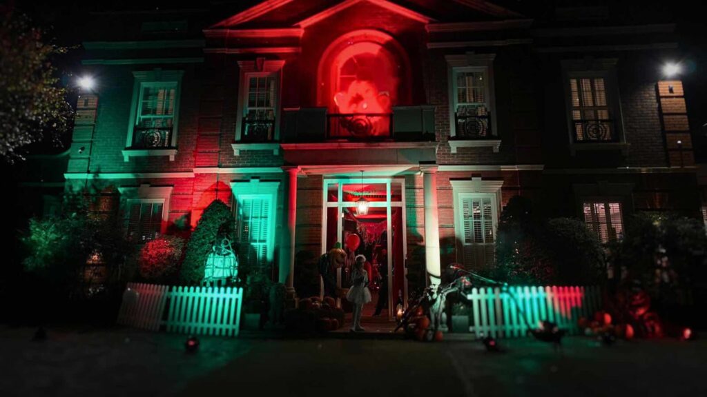 A Halloween house with decor outdoors.