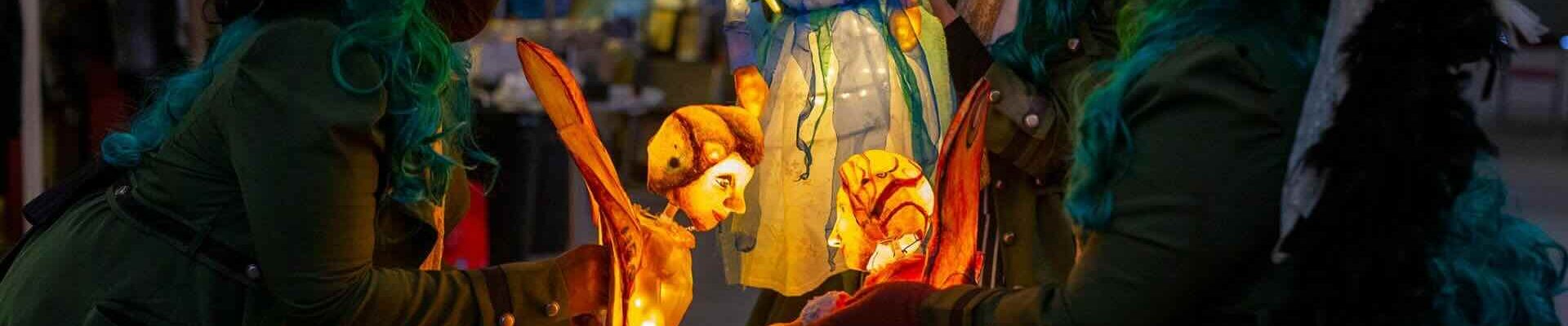 Illuminated-fairy-puppet-show-intricate-glowing-puppets