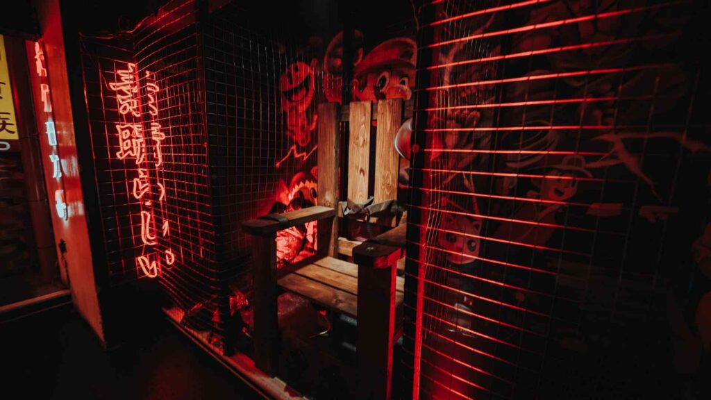 A SAW electric chair prop in a small section of an event.