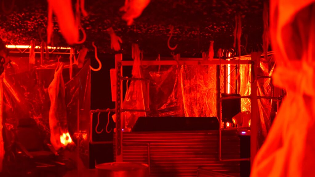 A slaughterhouse Halloween event with red lighting.