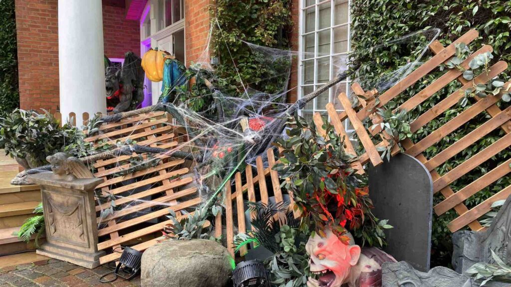 A spider invasion Halloween scene outdoors.