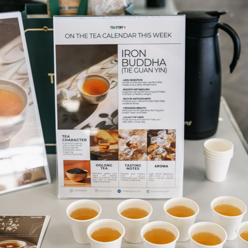 A menu/tea guide and tea samples at a company event.