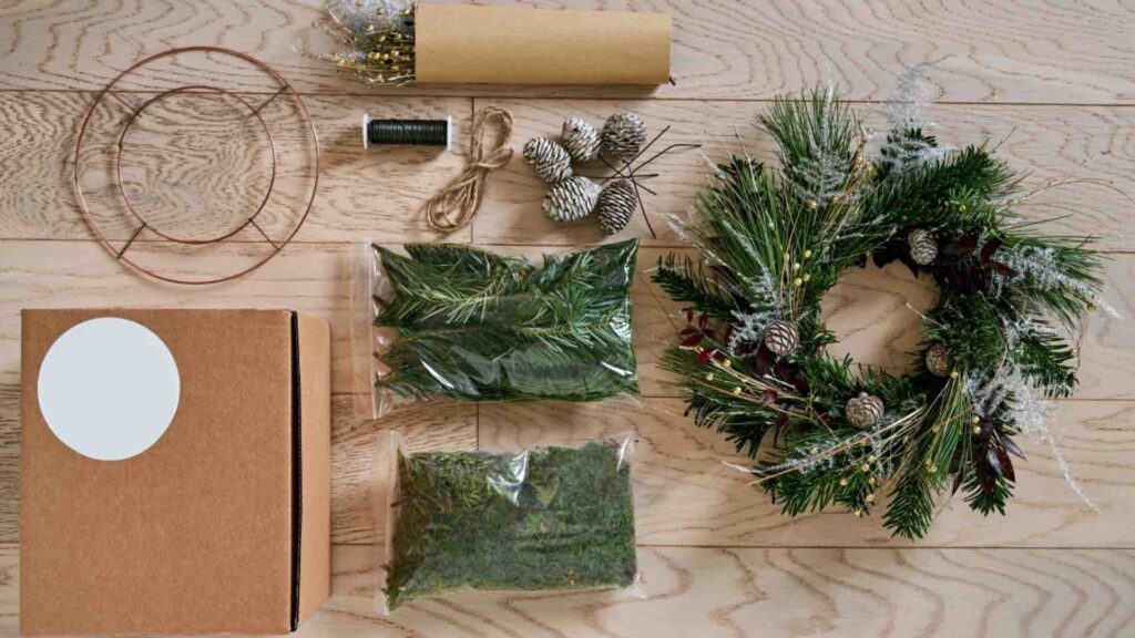 An assortment of materials to make a Christmas wreath.