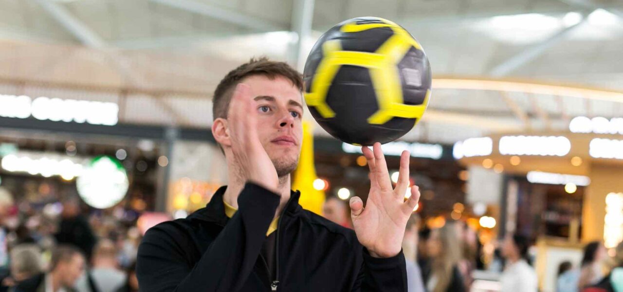 A football freestyler showcased impressive skills at a retail event.