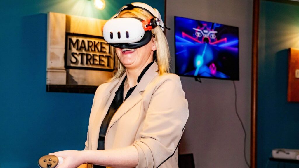 An event attendee utilising a VR headset for immersive experiences.