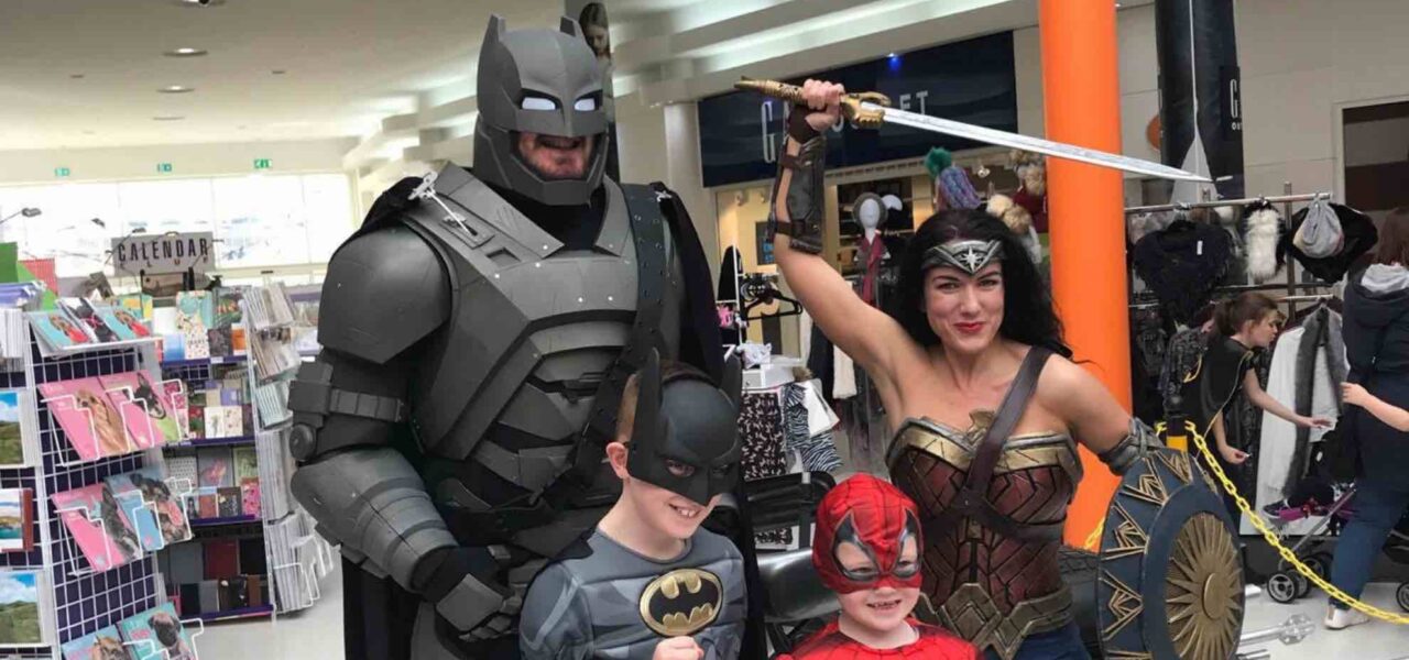 Superhero performers, including Batman and Wonder Woman, delighted kids by posing for photos at a retail activation event in the shopping centre