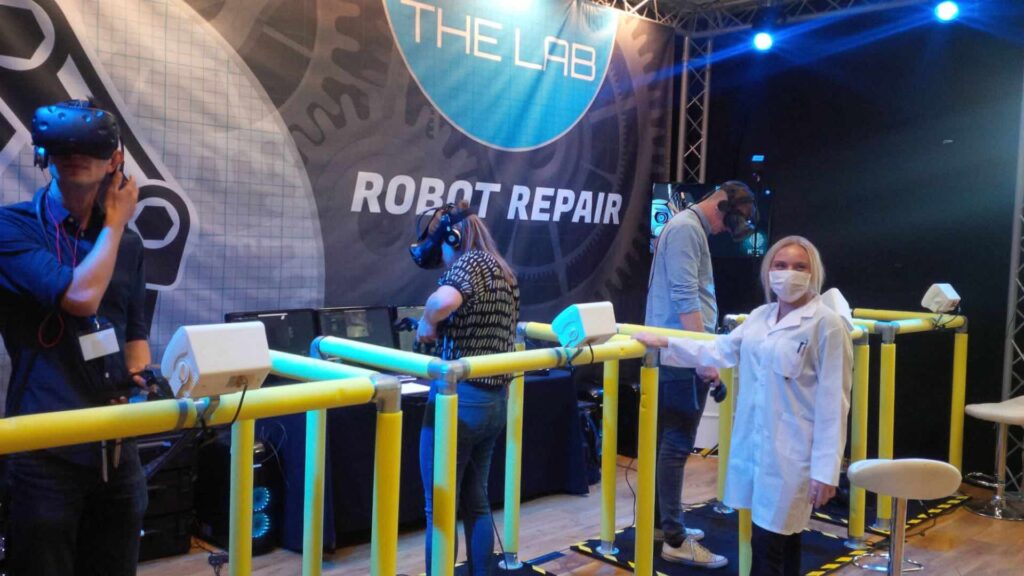 A group immersed in VR at an indoor exhibition event.