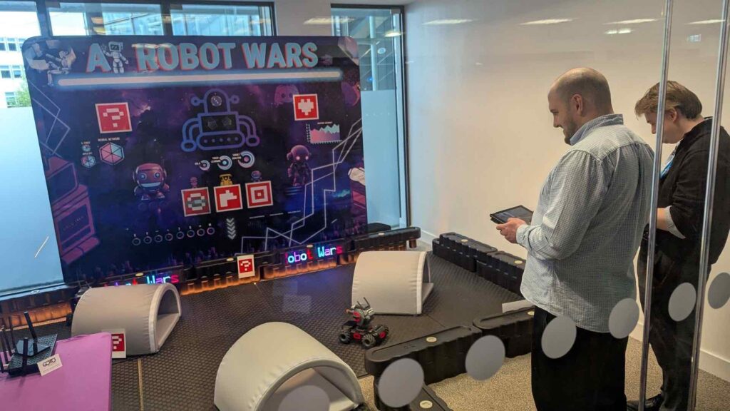 Retro robot wars game meets AI experience for events.