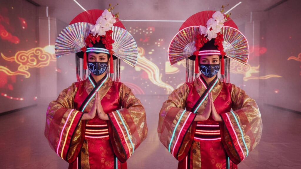 We enhanced this photo to have some futuristic edge showing two chinese new year performers in traditional clothing. 