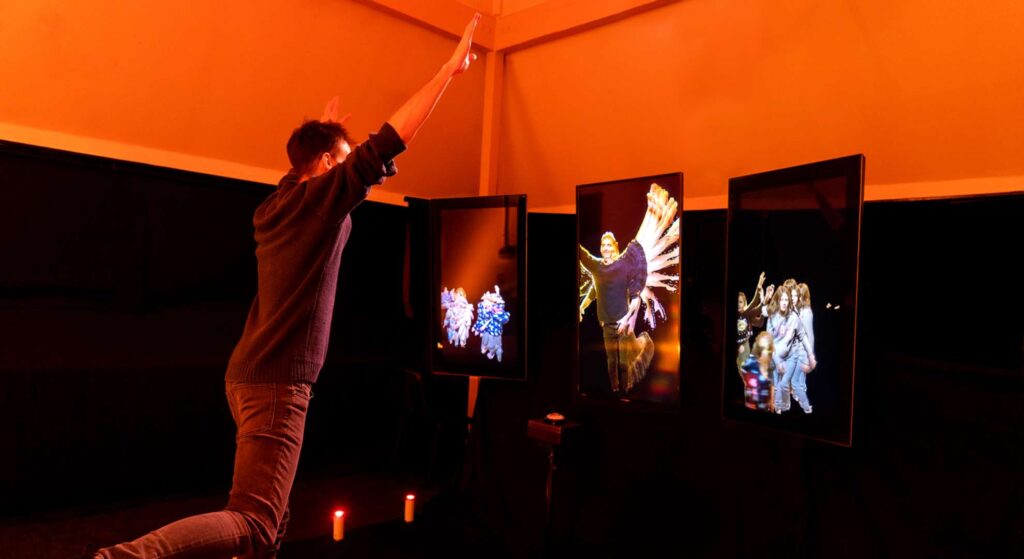 Guests exploring an interactive digital mirror installation at a product launch, highlighting immersive augmented reality mirror hire features.