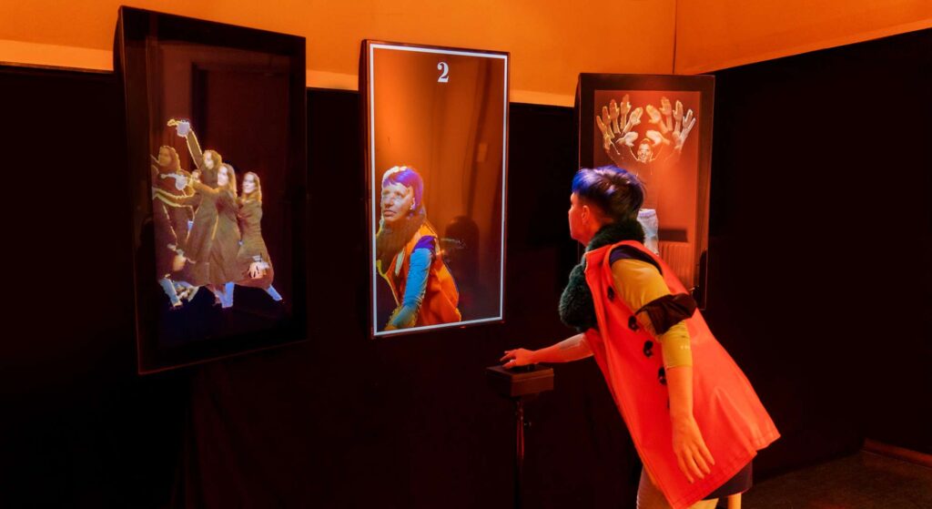 Attendees capturing 3D digital echoes in a corporate event attraction with a futuristic digital mirror setup.