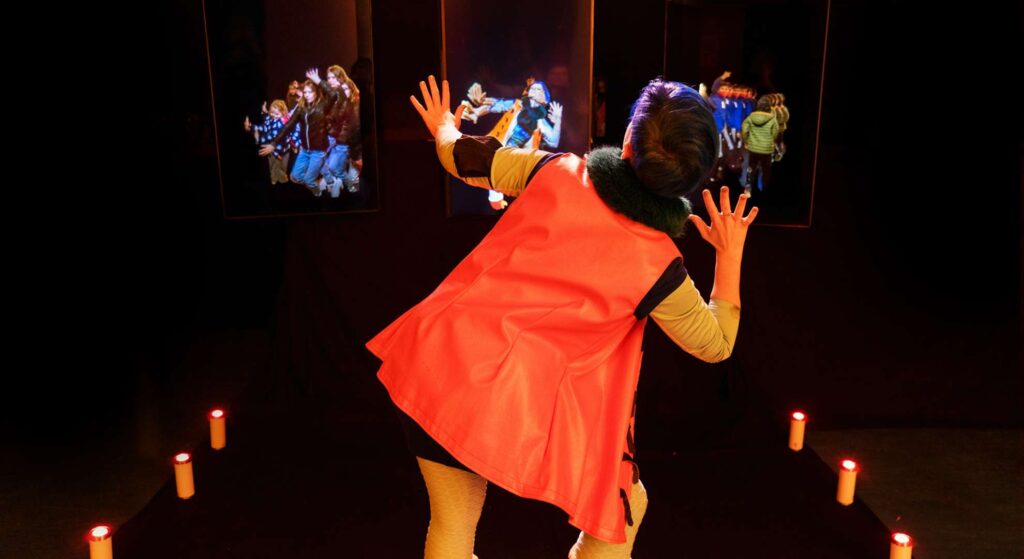 Guests interacting with a futuristic digital mirror at a corporate event, experiencing an immersive augmented reality mirror hire.