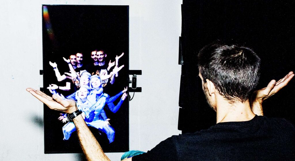 A guest interacting with a futuristic digital mirror, enjoying an immersive augmented reality mirror hire experience.