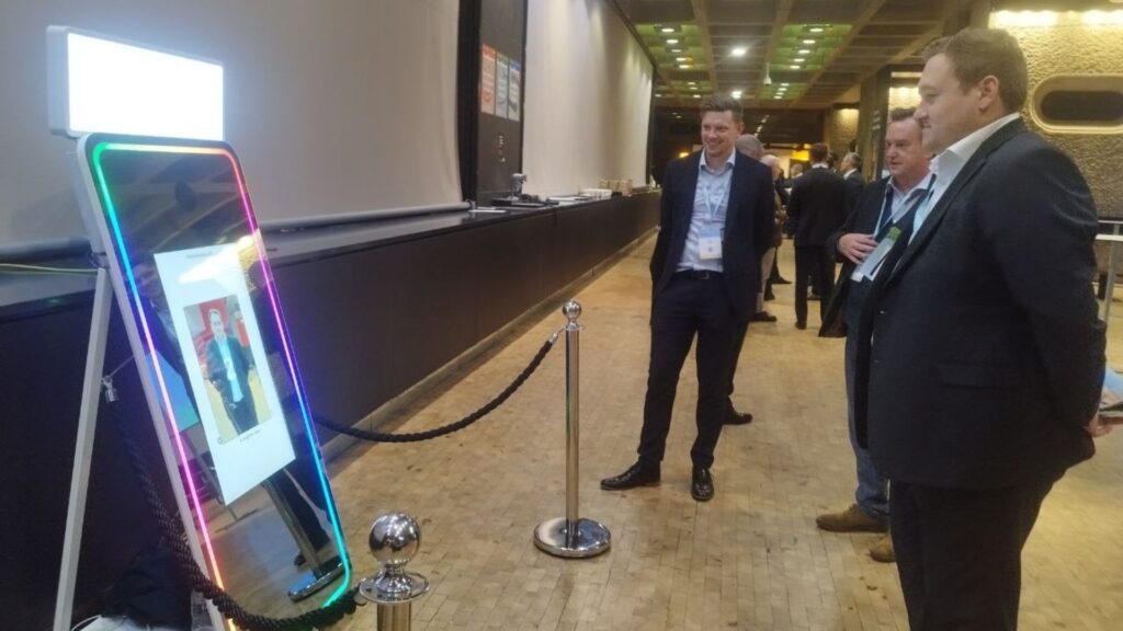 Man taking image at an AI photo booth.