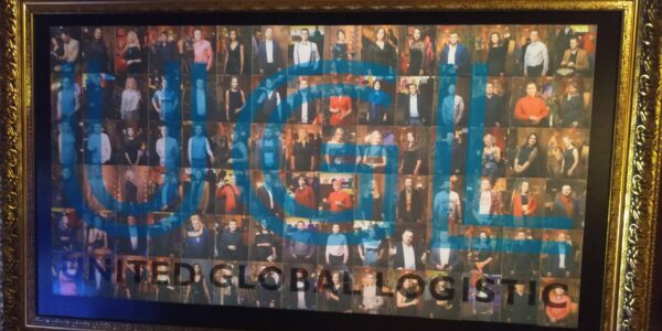 Finished photo mosaic wall featuring company branding and guest portraits.