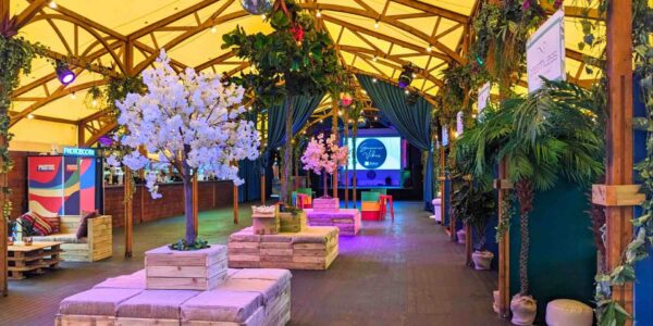 A vibrant festival themed event space with sustainable event services provided by Julia Charles Event Management.