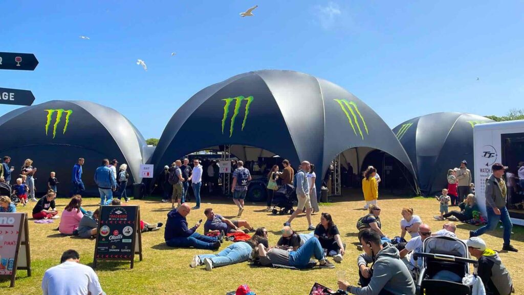 MONSTER branded dome hire at a festival scene.