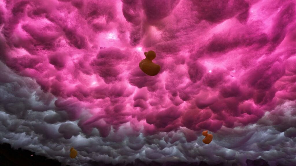 Close up of Fever Dream London distorted cloud ceiling design with rubber duck prop.
