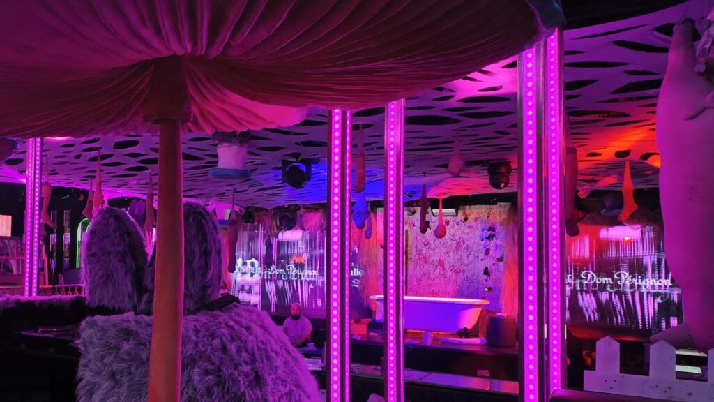 Fever Dream London ceiling design with hanging props and lighting.