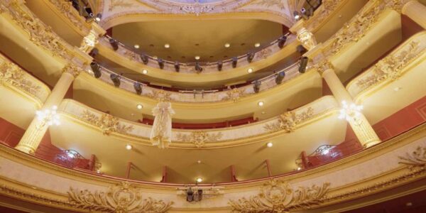 A gown mysteriously floats to the ceiling during this levitation performance.