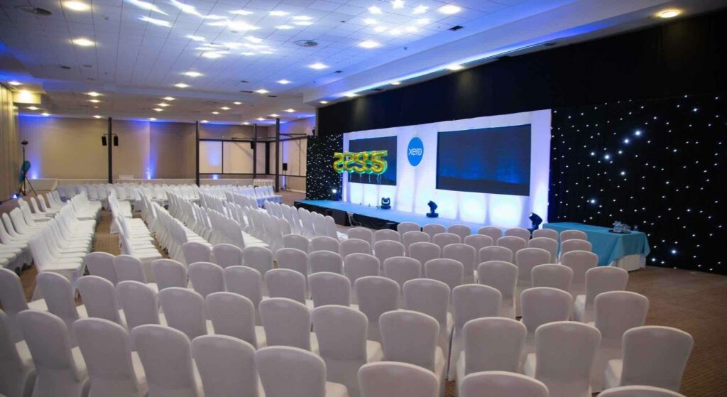 Event planners installed this impressive conference production with professional lighting, spotlights and seating for a conference in the UK.