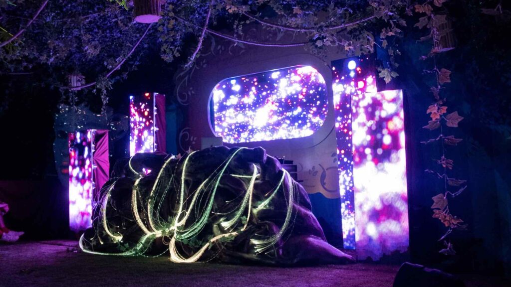 Glowy LED screens behind a bespoke, custom stage.