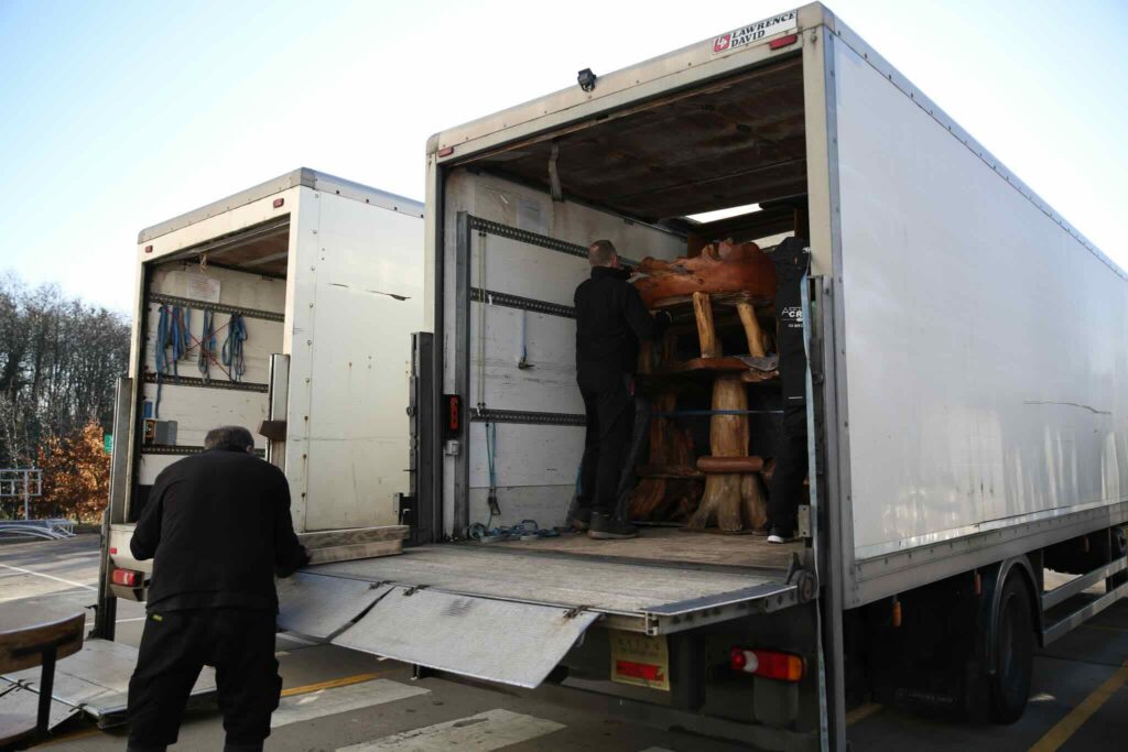A behind the scenes image from a Gymshark Christmas event, showing a van unloading furniture.