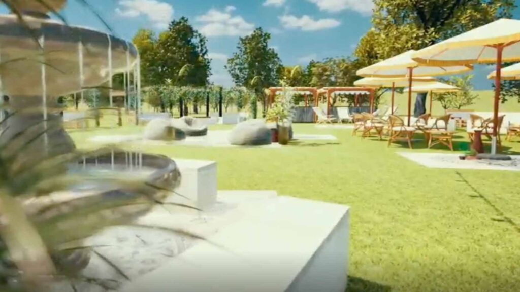 An outdoor Boho themed design with a fountain, seating areas and blue skies.
