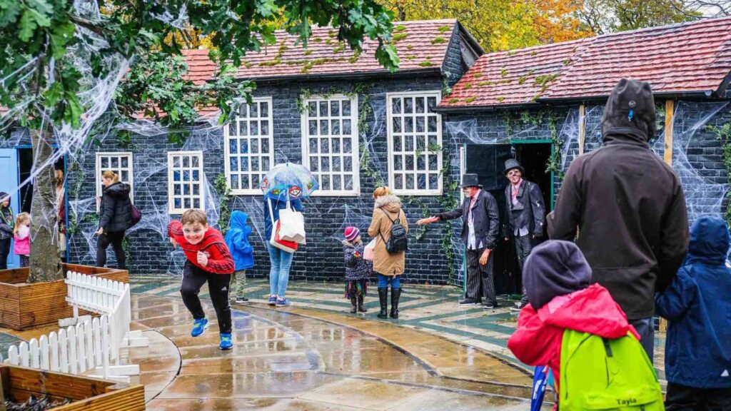 Trick or Treat Street set design with blue building and white windows designed for Southport BID as a prime visitor attraction. 