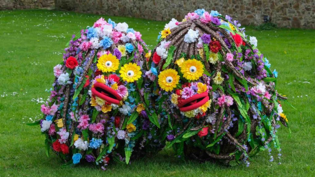 Flower tree puppet walkabout performers at Summer outdoor event perfect for families.