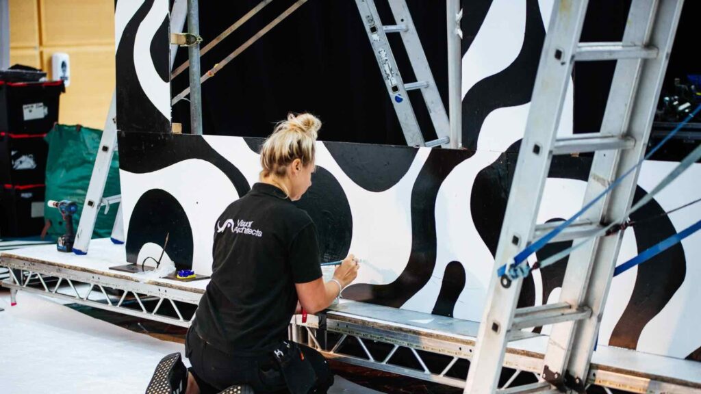 A behind the scenes shot of the team setting up a brand activation event.