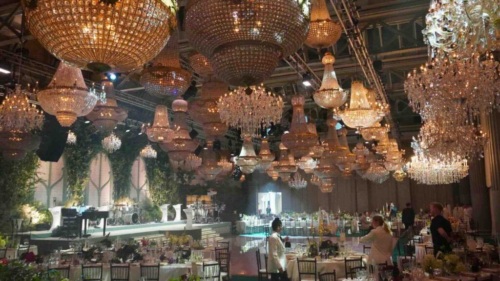A gorgeous indoor creative launch events space, with chandeliers in a historic building.