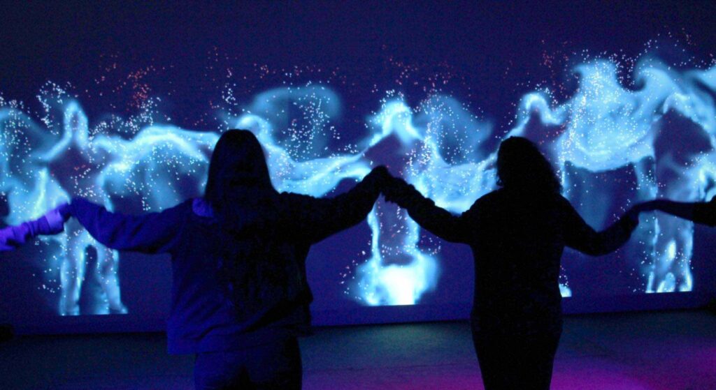 Interactive walls being used at a conference event.