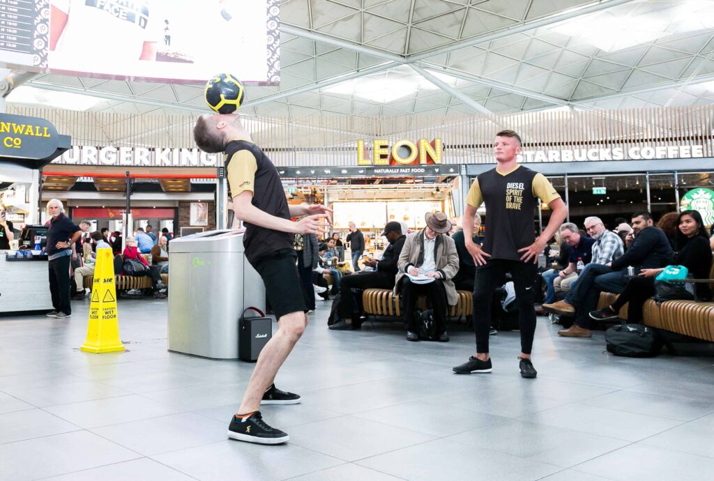 A shopping centre brand activation, with large crowds and football entertainment. 