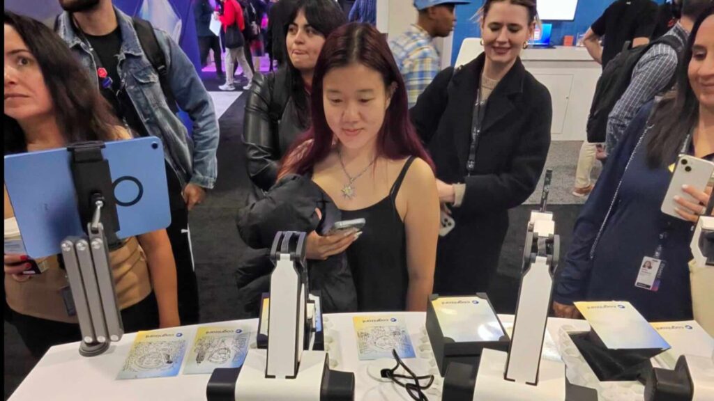 Woman looking at Ai sketch robot doing a portrait at an event.