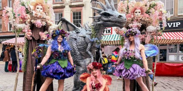 Masquerade-Stilt-Walking-Floral-Trees-Family-Fun-Day