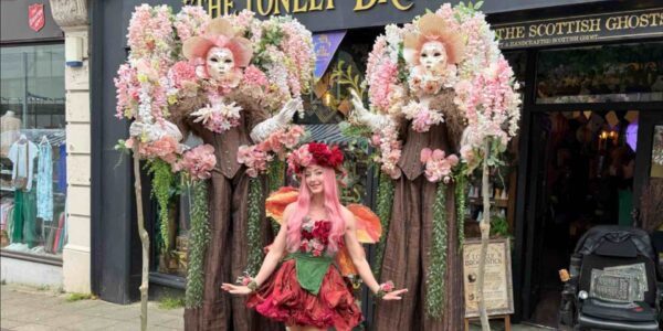 Masquerade-Stilt-Walking-Floral-Trees-Festivals