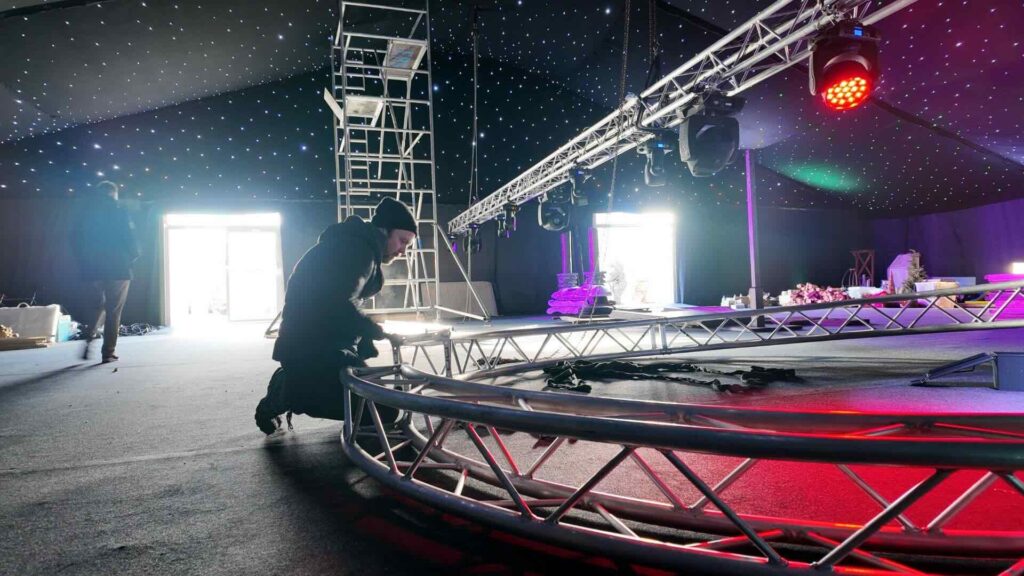Team setting up lighting and rigging at the GYMSHARK Christmas party.