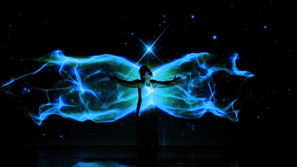 Video dance mapping show with a dancer and high-tech projections.