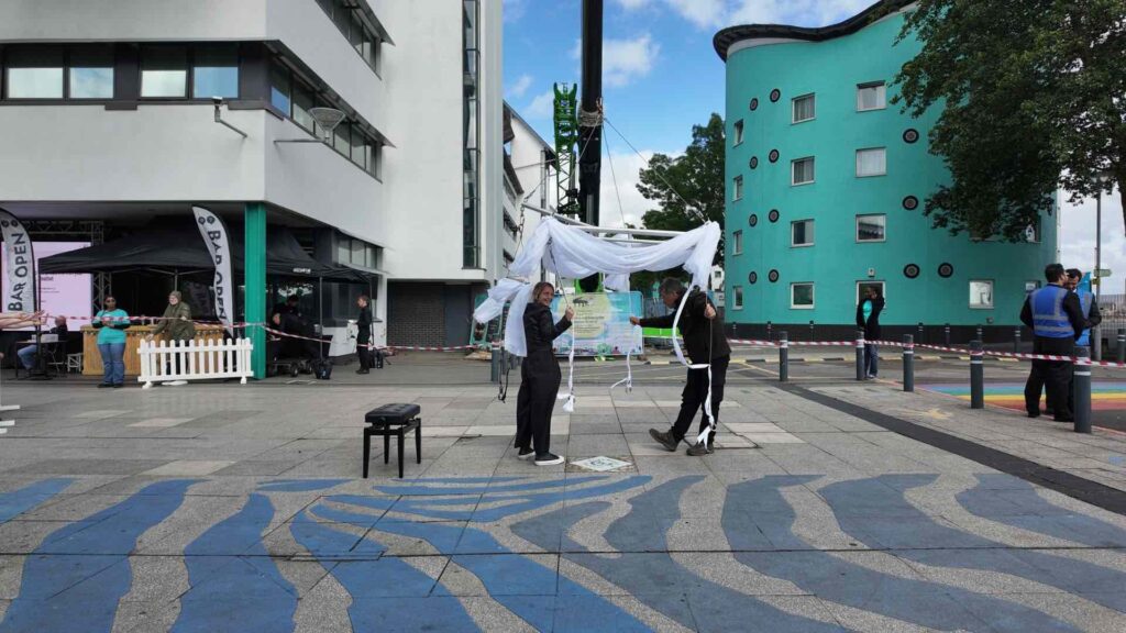 Julia on-site at UEL in London testing aerial rigging for a bespoke show.