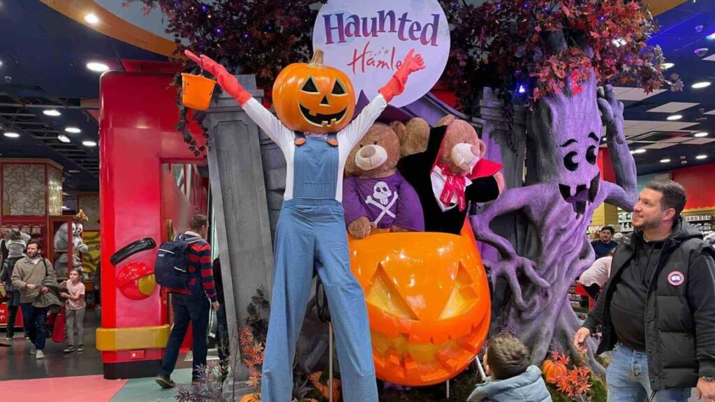 A Pumpkin stilt walker at a Hamley's shopping centre event.