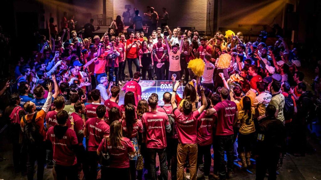 A ping pong team building event with a large crowd at a corporate event.