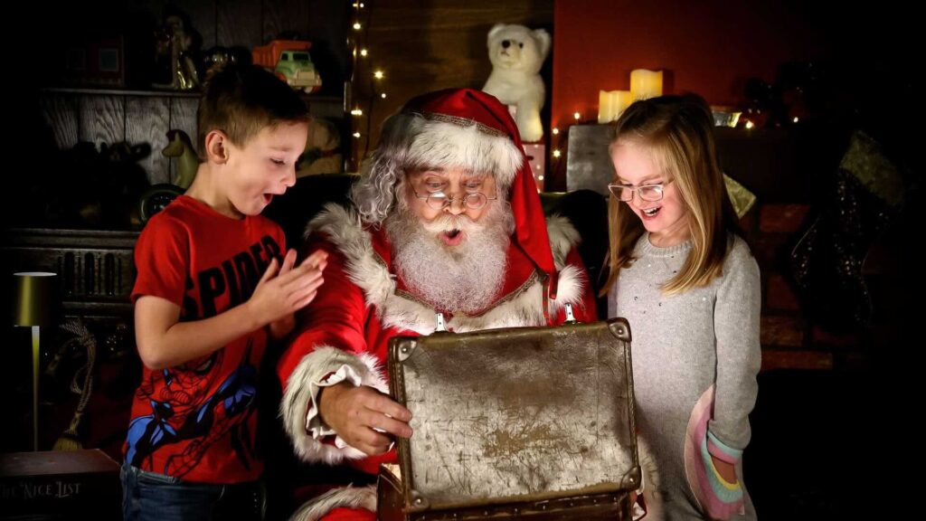 Santa Clause giving interactive festive experiences to children in Christmas.