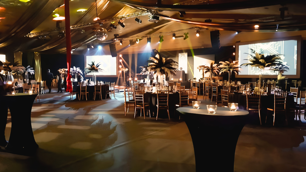 A Great Gatsby themed event with feathery table centrepieces and balloons.